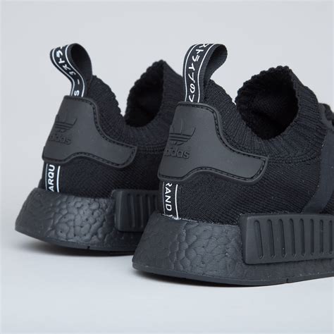 Adidas triple black NMD shoes